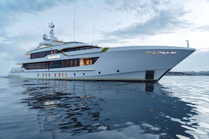 Superyacht at anchor on calm water